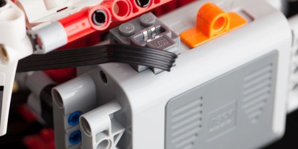 Close-up of a LEGO mechanical component with wires.