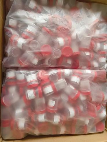 High-quality urine and stool containers with clear labeling, sealed for safe medical use.