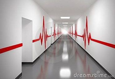 Long hospital corridor with red heartbeat line painted along white walls.
