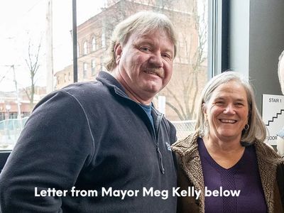 Bill Benton and Mayor Meg Kelley smiling for camera