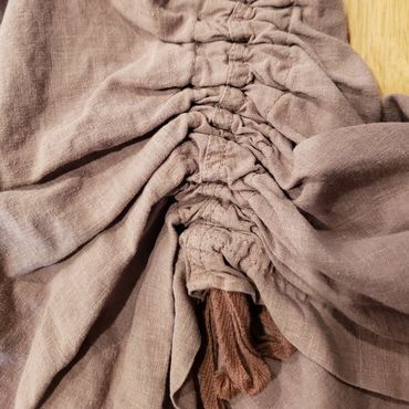 A customer requested these drawstring gathers at the side of a pair of linen pants.
