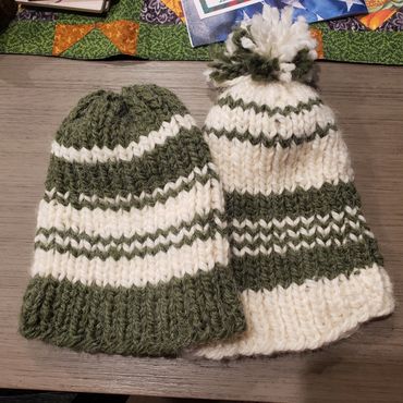 Green and white knitted hats