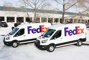 FedEx Ground delivery vans, car wrap, graphic design, custom decals, car graphics Calgary