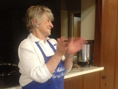 Elderly female clapping.