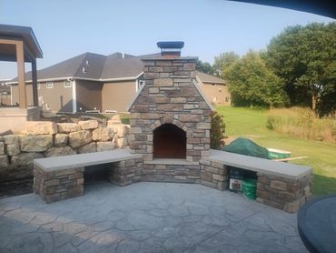 Outdoor Fireplace, biesanz stone benches with Dutch Quality cultured ledge stone. Custom built out