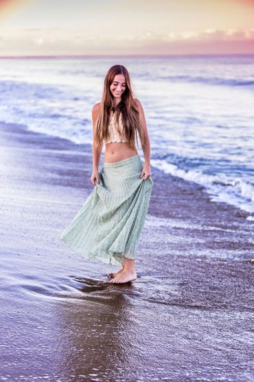 smiling girl at beach at water's edge