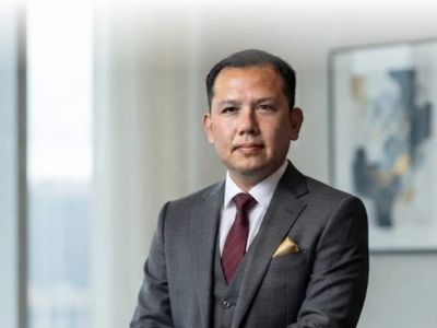 Professional man in a suit posing for a portrait.