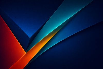 Abstract geometric shapes in blue and orange with sharp edges.
