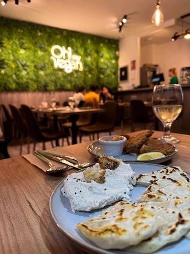 Couple relishes hummus—vegan evening glows