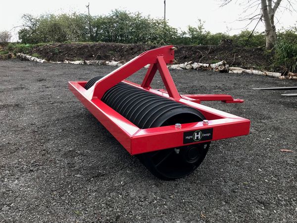 Photograph of a roller outside in a yard.