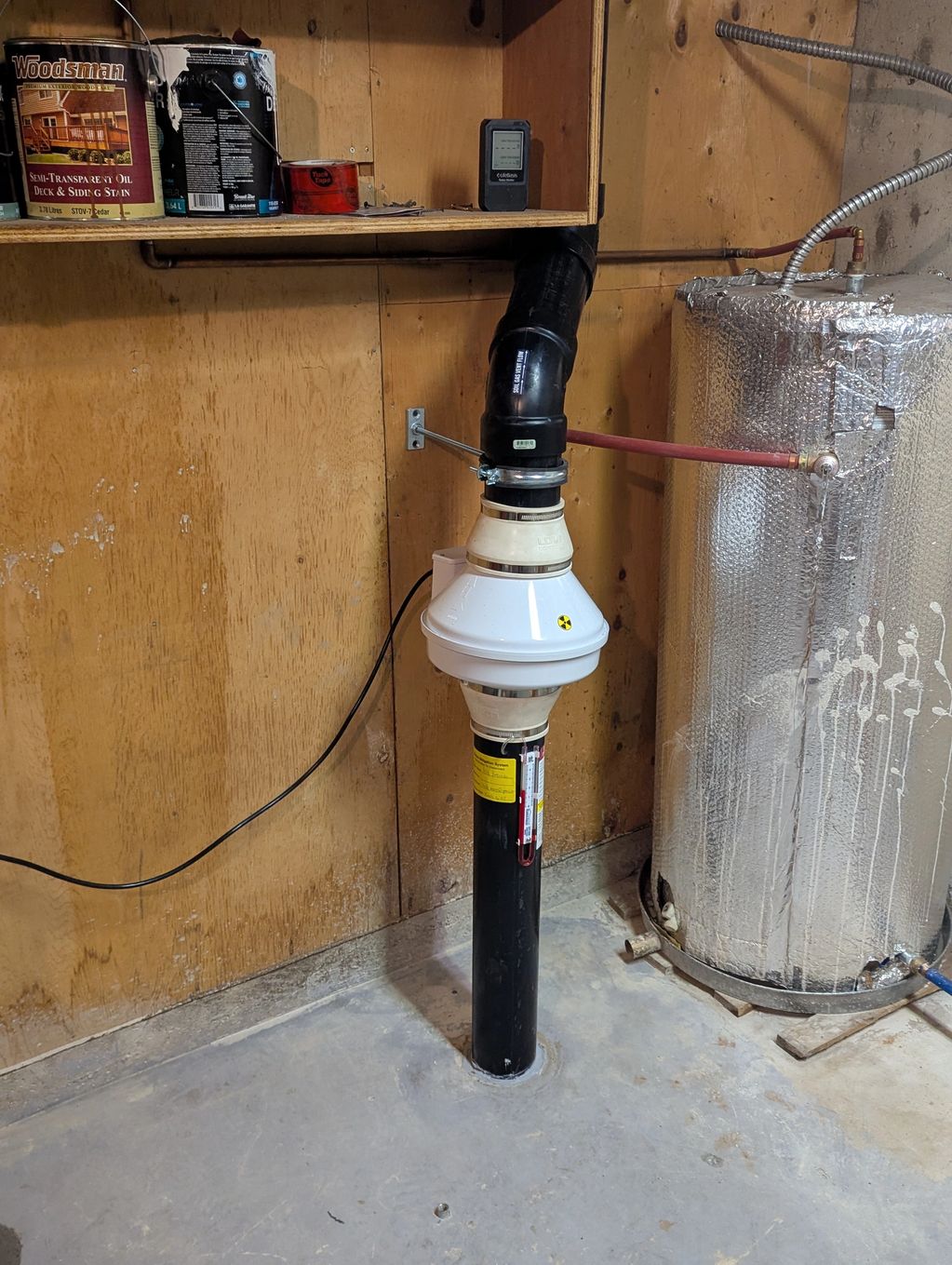 Radon mitigation fan installation.