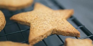 Star-shaped cookie on a cooling rack.