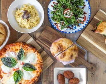 Italian dishes including pizza, pasta, salad, and sandwiches.