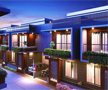 Modern townhouses with balconies and greenery, illuminated at dusk.