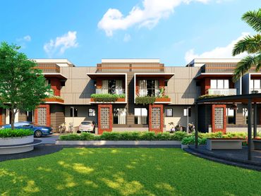 Modern townhouses with green lawns and blue sky background.