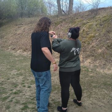Woman and man at outdoor range