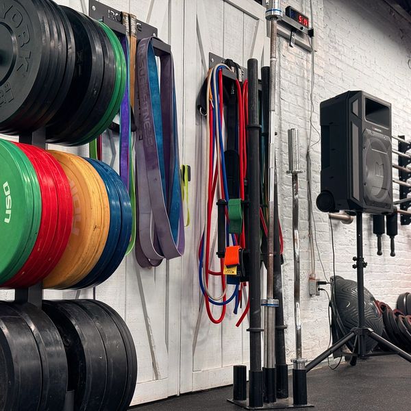 Weight plates and resistance bands in a gym.