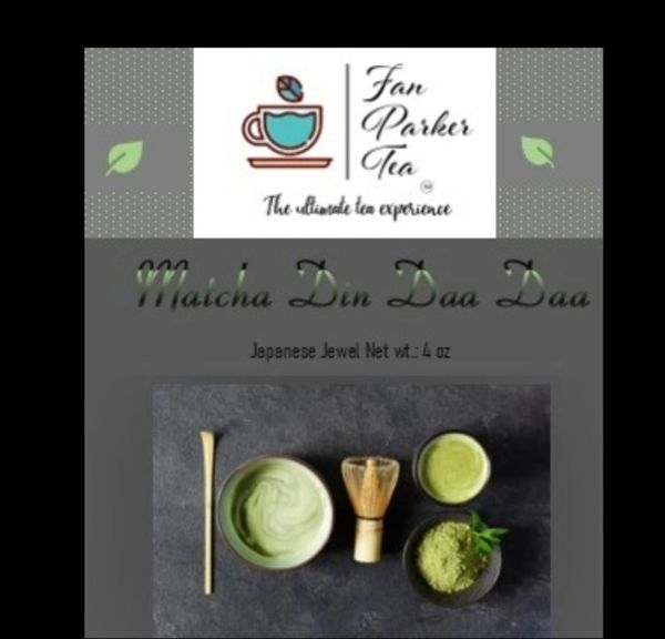 Matcha tea set with powder, whisk, and bowl.