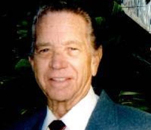 Portrait of an elderly man in a suit and tie.