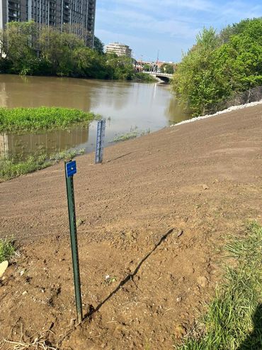 We cleaned up the levy & hauled in 14 loads to get the slope back & installed 4 loads of rip rap.