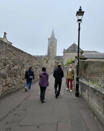 Tour Group walking through the streets of St.Andrews on a misty morning