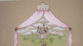 castle with soft pink drapes in a girls room.
