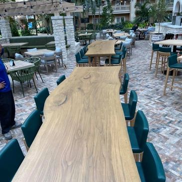 Outdoor tables with green chairs