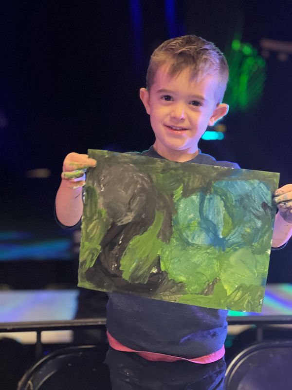 All Children's Art Center - Happy kid with his amazing creation in arts..