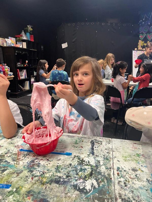 Children developing artistic skills in an engaging art class