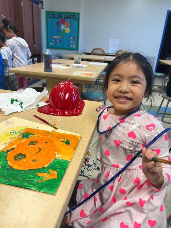 All Children's Art Center Children working on their art projects with clay and paints
