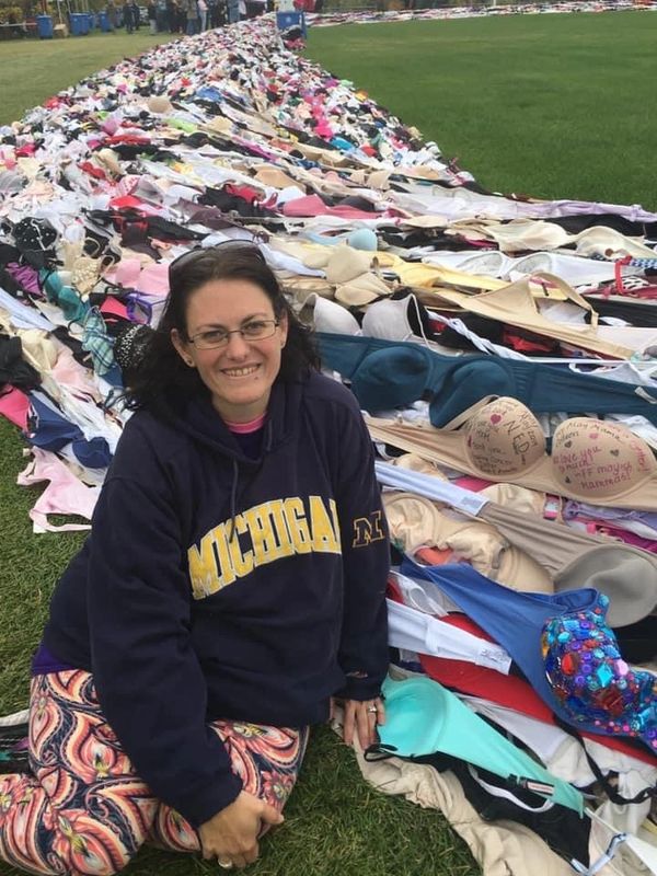 Goddess Jenn next to the world’s longest bra chain