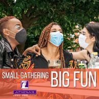 A group of three masked friends at a small gathering