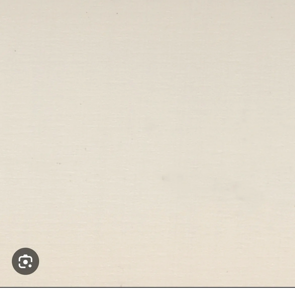 A close-up of a plain beige textured surface.