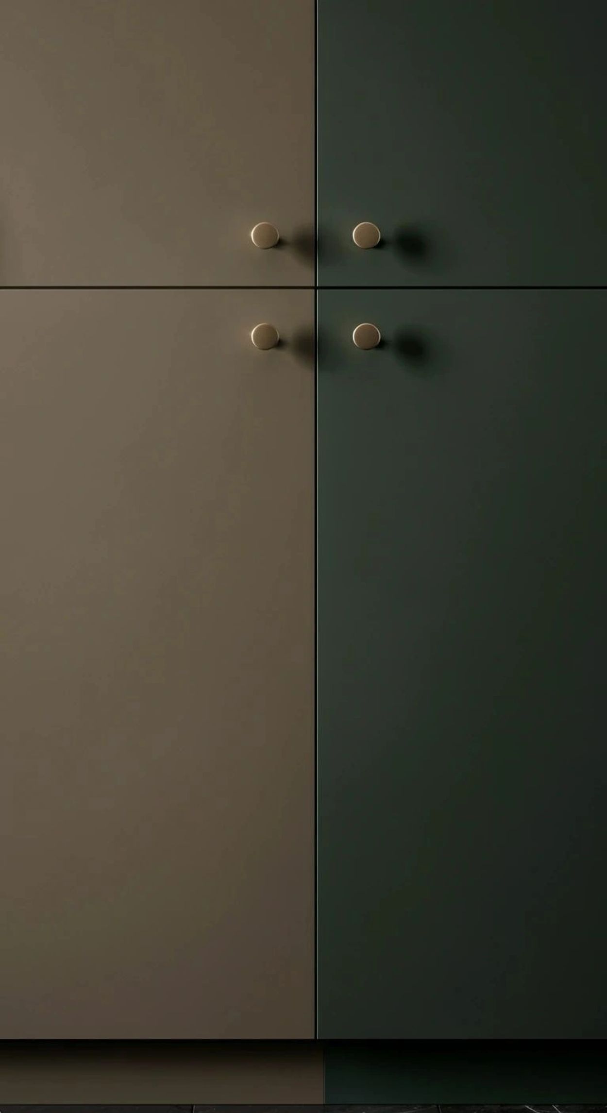 Minimalist cabinet doors in matte brown and dark green with round gold knobs.