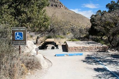 Photo of an accessible parking space, accessible park bench, and accessible camping spot sign.