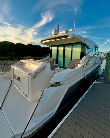 White centre console boat at Cape Cod marina after professional detailing by Blackline Marine Care
