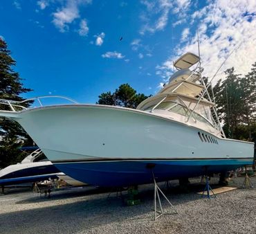 Large sportfish boat on stands after professional gelcoat correction in Cape Cod, MA