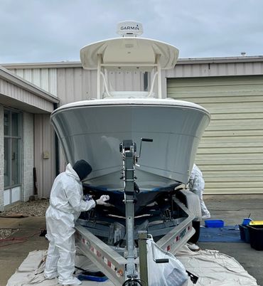 Blackline Marine Care technician performing gelcoat correction on centre console bow in Cape Cod, MA