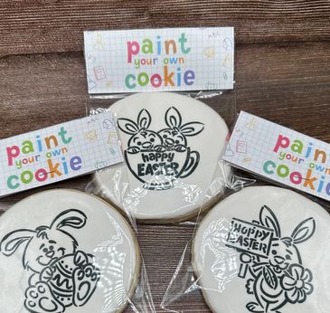 Easter-themed paint-your-own cookies with bunny designs.