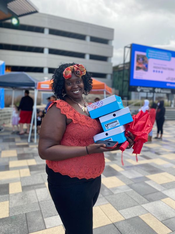 Kaliyah Wheeler  1st Annual 300 pair shoe give away W/ T-rell Topeka KS (year 2000)