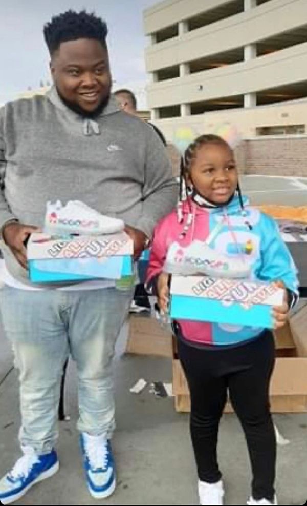 Kaliyah Wheeler  1st Annual 300 pair shoe give away W/ T-rell Topeka KS (year 2000)