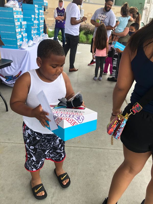 Kaliyah Wheeler  2nd Annual 500 pair shoe give away W/ T-rell Topeka KS (year 2001)