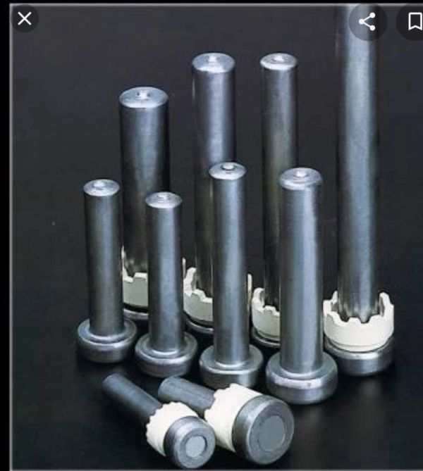 Set of various sizes of metal dowel pins with white collars.