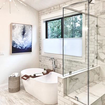 Clean modern bathroom with marble tile flooring featuting Troutdale house cleaning service.
