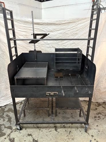 Large black metal grill with multiple cooking sections and adjustable racks.