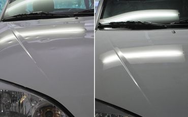 Comparison of a car hood before and after dent repair.