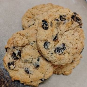 Close-up of oatmeal raisin cookies on a surface.