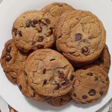 Plate of freshly baked chocolate chip cookies.