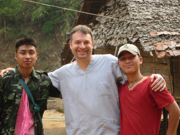 Bob taking a break with two students.