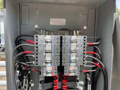 Commercial electrical distribution panel sized for EV charging and facility loads
